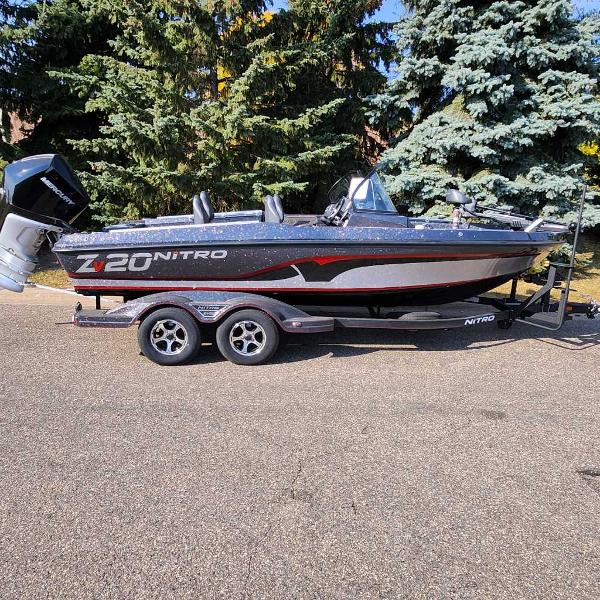 Nitro ZV20 Pro 2024 Nitro ZV20 Pro fishing boat on trailer, parked outdoors.