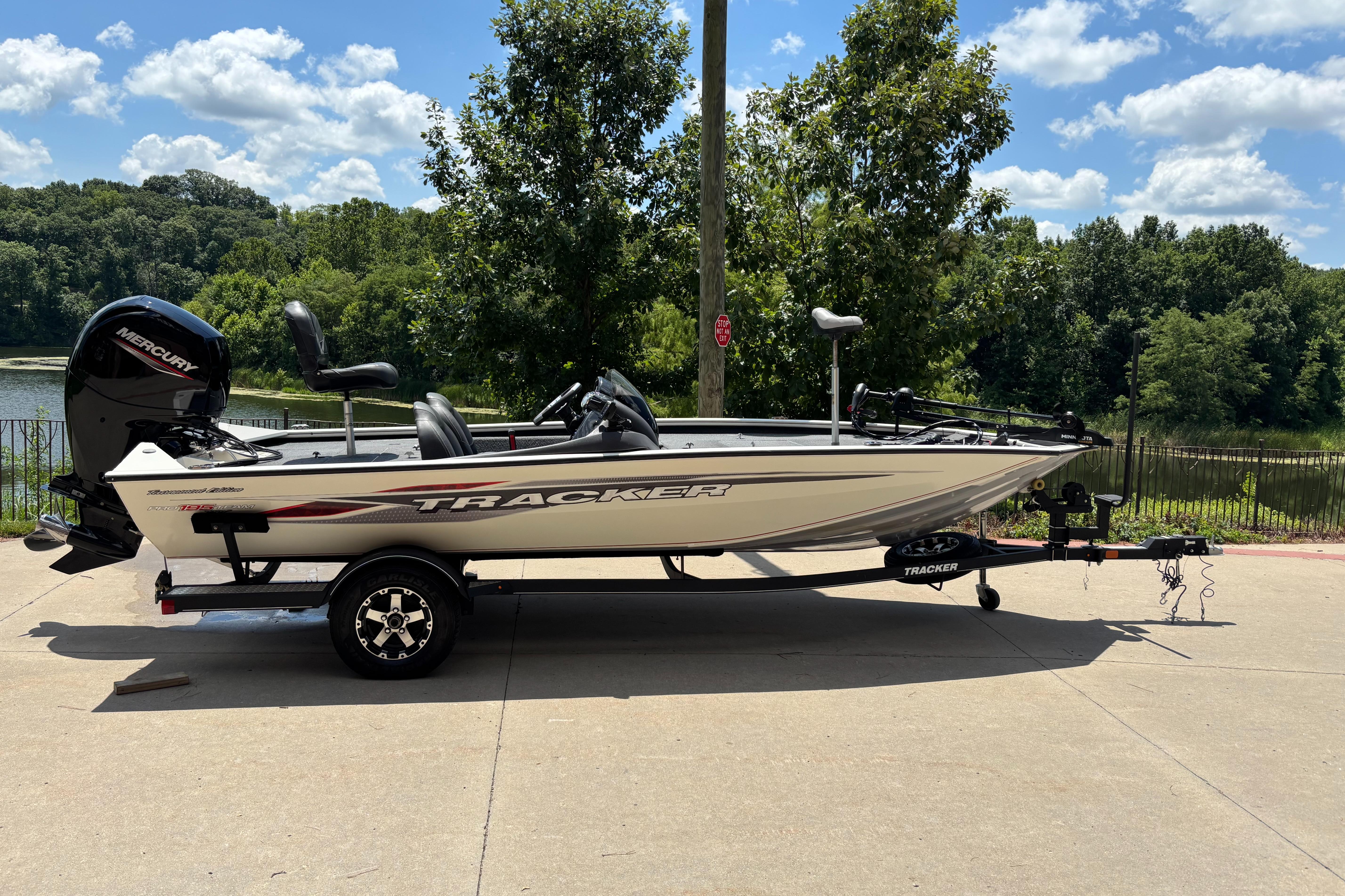 Tracker Pro Team 195 TXW Tournament Edition 2020 Tracker Pro Team 195 TXW Tournament Edition boat on trailer, parked near a scenic lake.