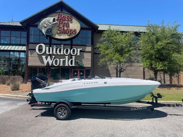 Tahoe T18 2025 Tahoe T18 boat on trailer outside Bass Pro Shops Outdoor World.