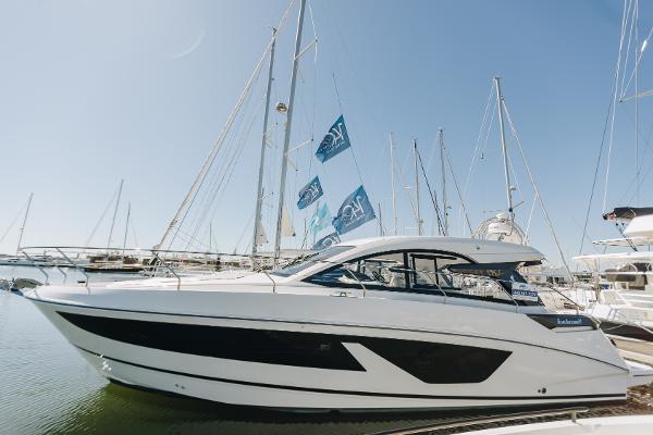 Beneteau Gran Turismo 41 2023 Beneteau Gran Turismo 41 yacht docked at marina under clear blue sky.