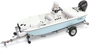 Mako Pro Skiff 13 CC 2025 Mako Pro Skiff 13 CC boat on trailer, featuring a sleek design and Mercury outboard motor.