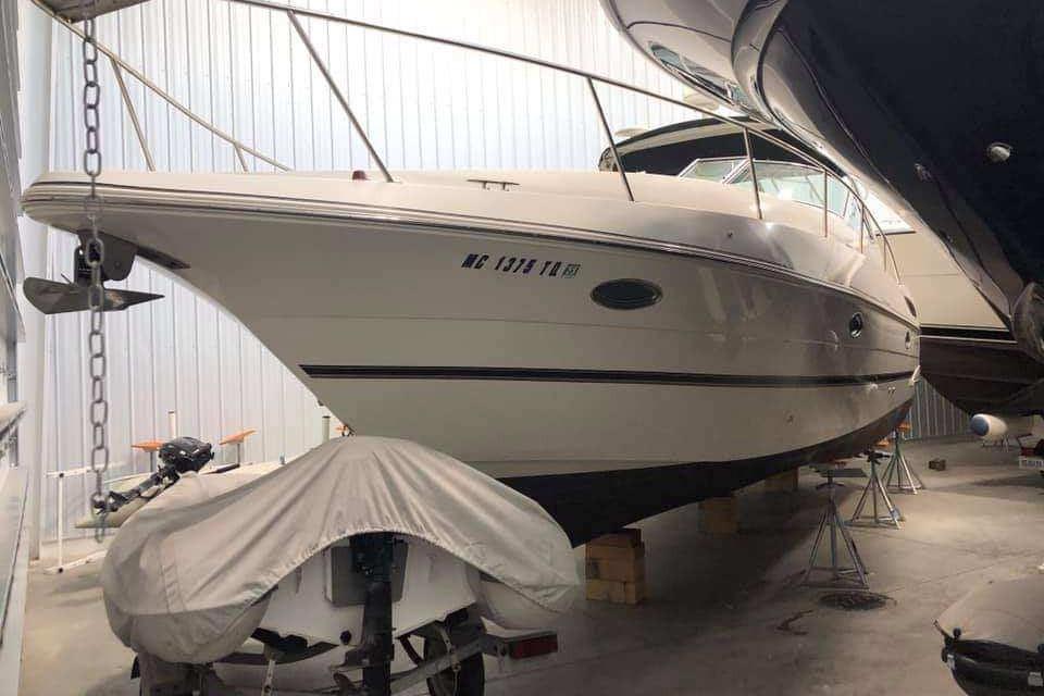 Cruisers Yachts 3470 Express 2001 Cruisers Yachts 3470 Express in storage, side view, indoors.