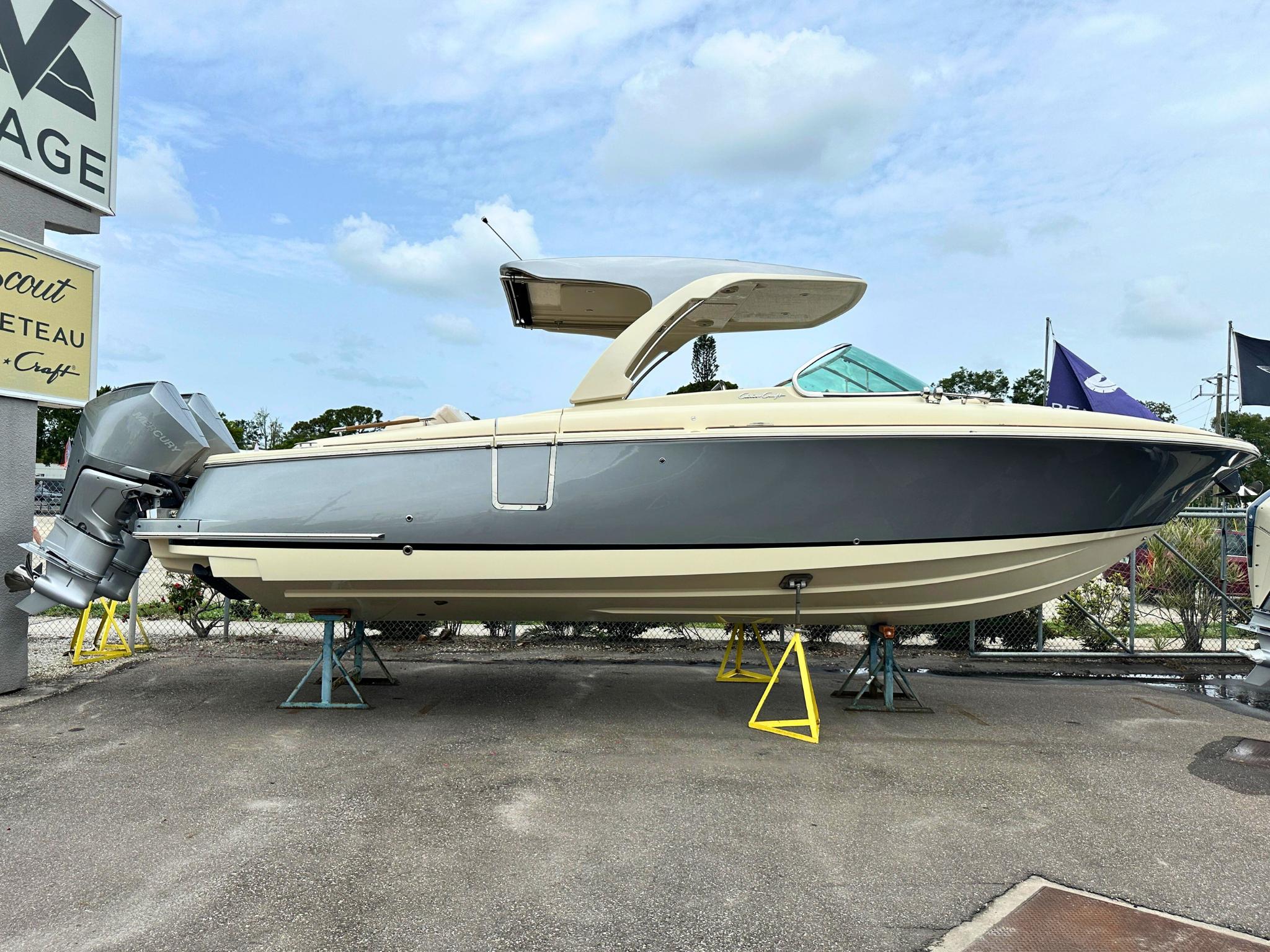 Chris-Craft Launch 31 GT 2025 Chris-Craft Launch 31 GT boat on display, featuring sleek design and modern outboard engines.