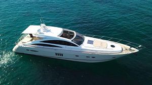 Princess V70 Luxury 2006 Princess V70 yacht cruising on clear blue water.
