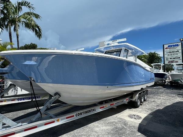 Robalo R360 Center Console 2025 Robalo R360 Center Console boat on trailer, displayed outdoors under a clear sky.