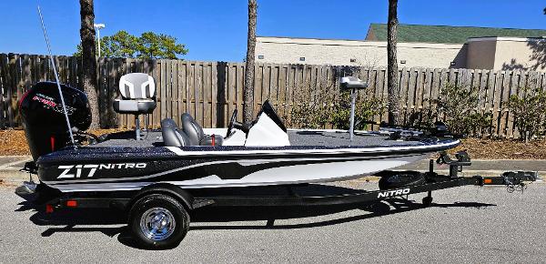 Nitro Z17 2025 Nitro Z17 fishing boat on trailer, parked outdoors.