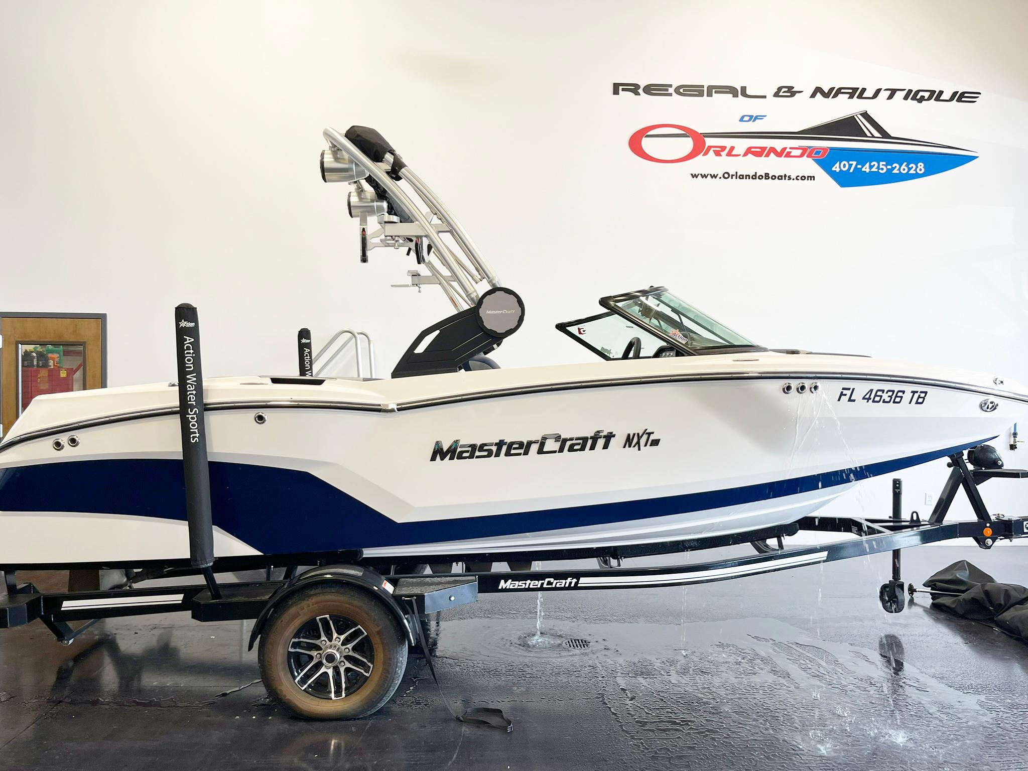 MasterCraft NXT20 2022 MasterCraft NXT20 boat on trailer at Regal & Nautique of Orlando showroom.