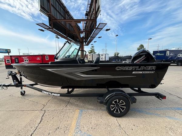Crestliner 1650 Kodiak 2025 Crestliner 1650 Kodiak boat on trailer, parked outdoors under a clear sky.