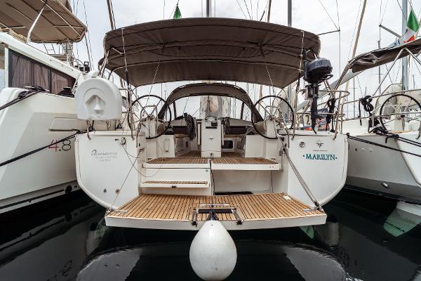 Jeanneau Sun Odyssey 440 2019 Jeanneau Sun Odyssey 440 yacht docked, rear view with open cockpit and canopy.