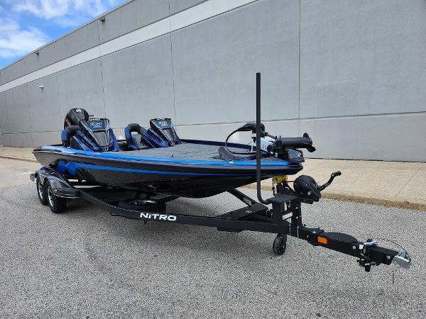 Nitro Z21 XL 2025 Nitro Z21 XL boat on trailer, sleek design, blue accents, parked outdoors.