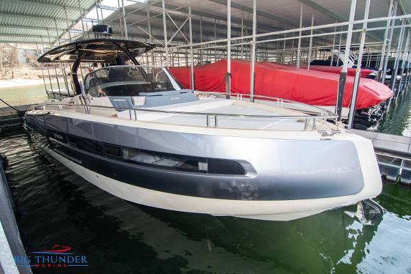 Invictus GT370S 2024 Invictus GT370S luxury yacht docked at marina.