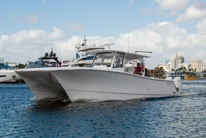 Front Runner 43 Catamaran 2025 Front Runner 43 Catamaran cruising on water with cityscape background.