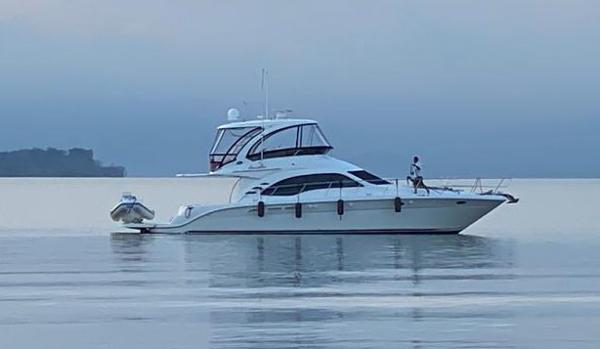 Sea Ray 52 Sedan Bridge 2007 Sea Ray 52 Sedan Bridge yacht on calm water at dusk.