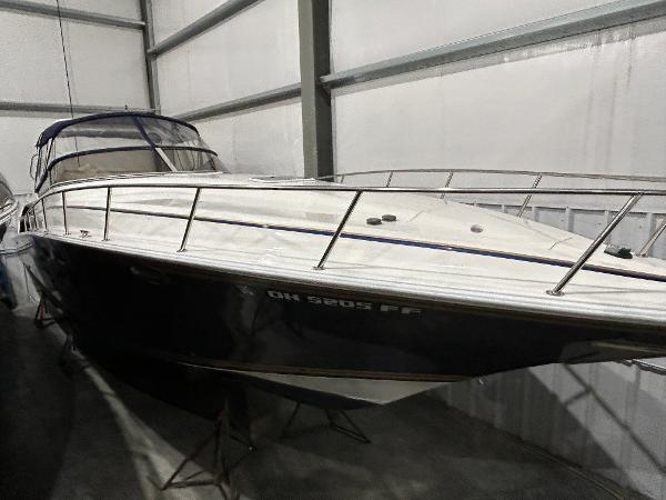 Fountain 38 Express Cruiser 2002 Fountain 38 Express Cruiser in storage, sleek design, white and navy exterior.