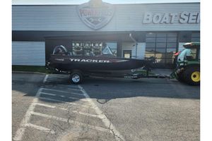 Tracker Pro Guide V-175 Combo 2026 Tracker Pro Guide V-175 Combo boat on trailer outside service center.
