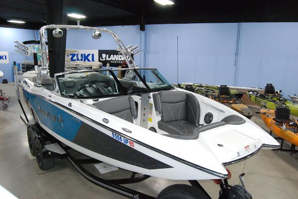 MasterCraft X23 2016 MasterCraft X23 boat in showroom, featuring sleek design and modern interior.
