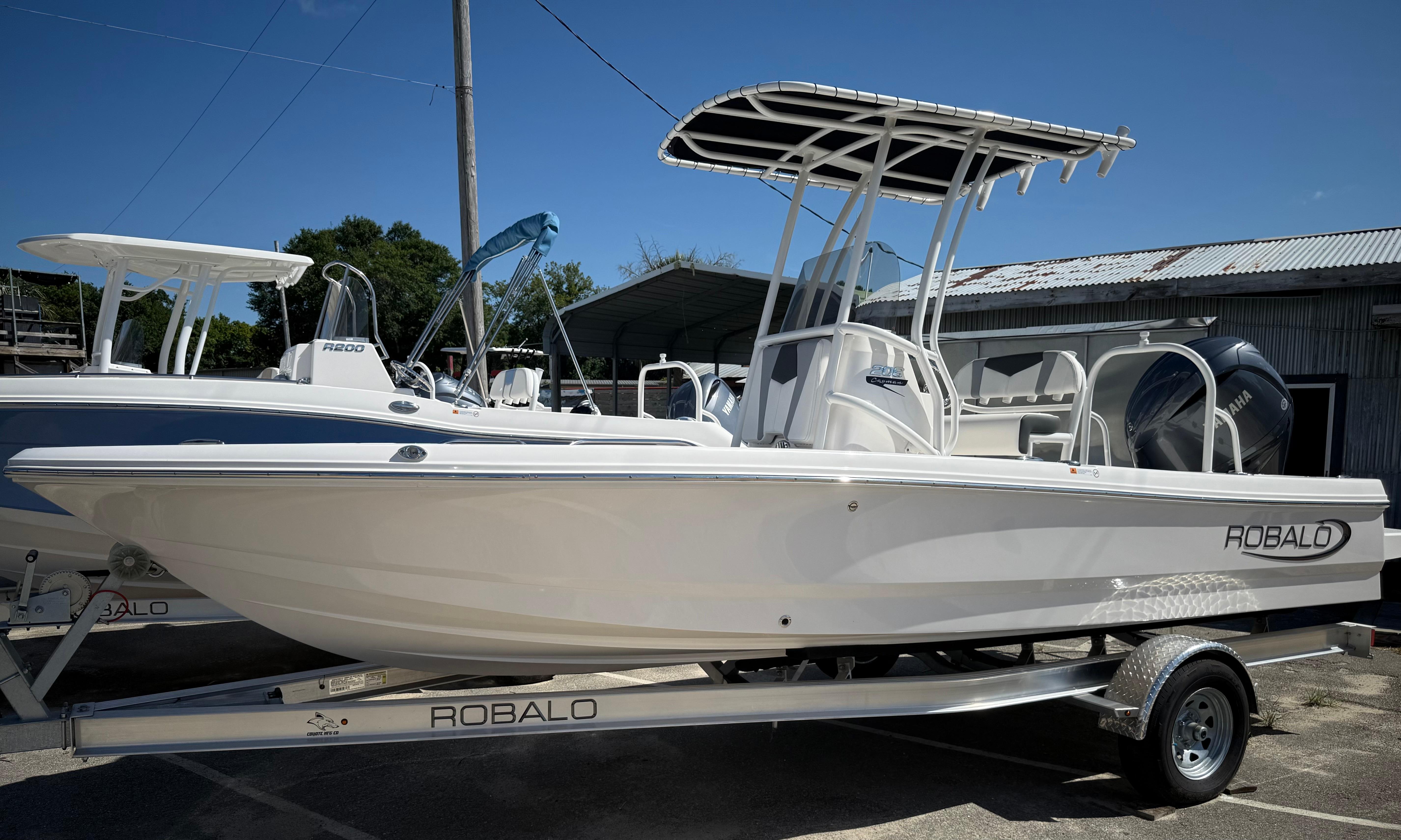 Robalo 206 Cayman 2025 Robalo 206 Cayman boat on trailer, featuring sleek design and modern features.