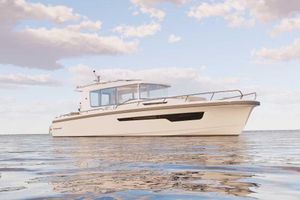 Nimbus Commuter 12 2026 Nimbus Commuter 12 boat on calm water under a partly cloudy sky.