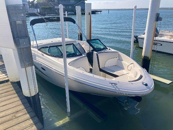 Sea Ray 190 Sport 2012 Sea Ray 190 Sport boat docked on calm water.