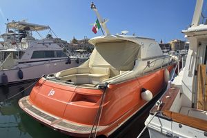 Mochi Craft 44 Dolphin 2010 Mochi Craft 44 Dolphin yacht docked in a marina, featuring a sleek orange exterior.