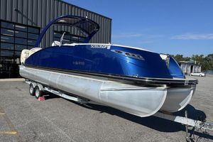 Harris Crowne SL 270 Twin Engine 2021 Harris Crowne SL 270 Twin Engine pontoon boat on trailer, blue exterior.