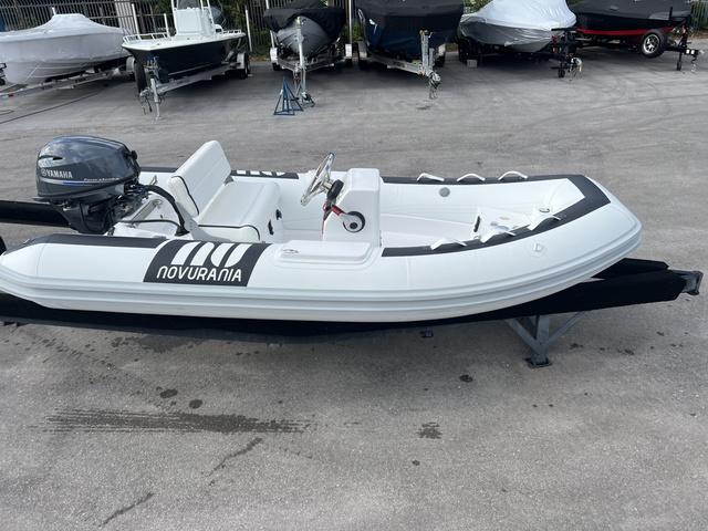 Novurania DL 335 2024 Novurania Deluxe 335 boat with Yamaha engine on trailer.