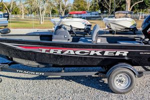 Tracker Super Guide V-16 SC 2026 Tracker Super Guide V-16 SC boat on display in a parking lot.