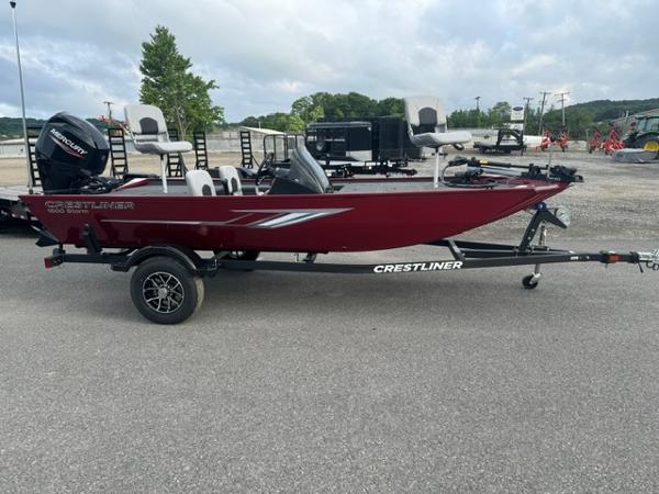 Crestliner 1600 Storm 2024 Crestliner 1600 Storm fishing boat in red, on a trailer, with Mercury outboard motor.