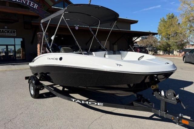 Tahoe T16 2026 Tahoe T16 boat on trailer with canopy, parked outdoors.