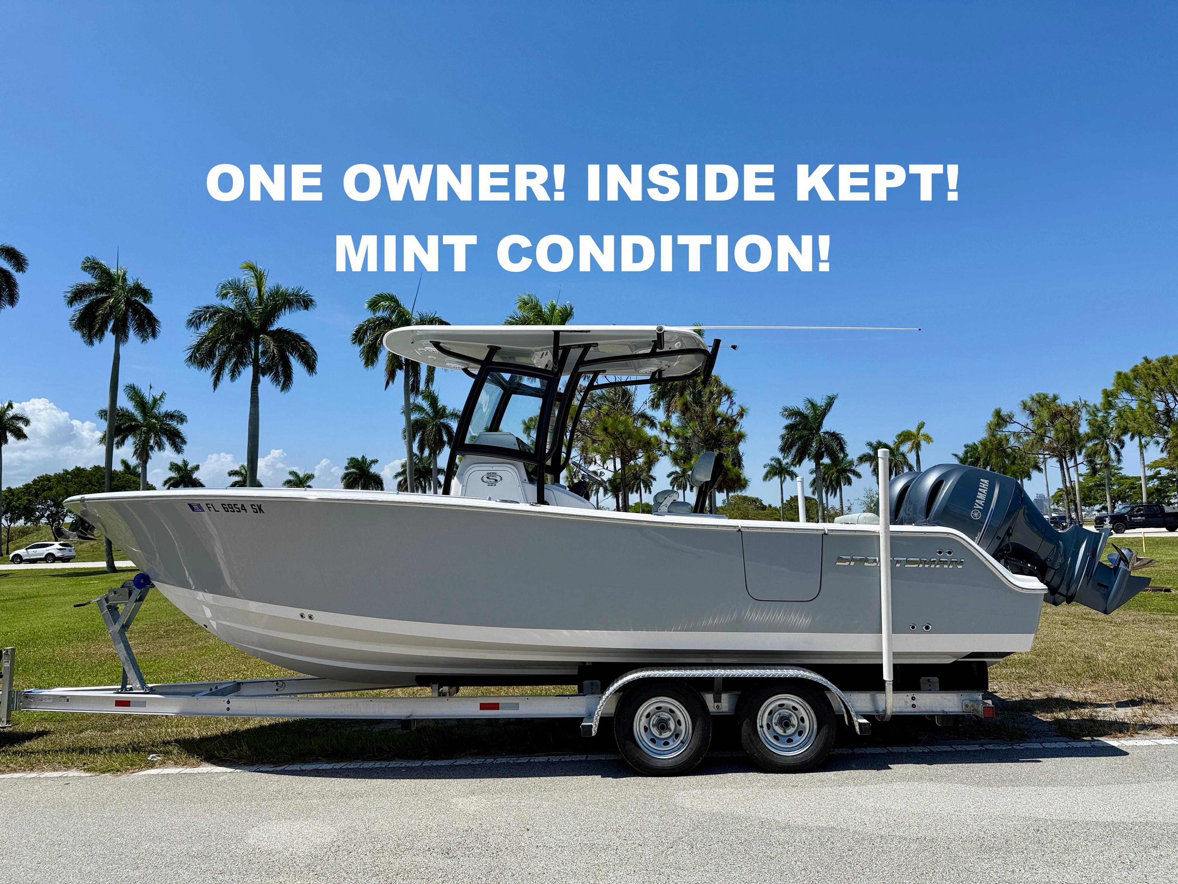 Sportsman Open 252 Center Console 2019 Sportsman Open 252 Center Console boat in mint condition on trailer, palm trees background.