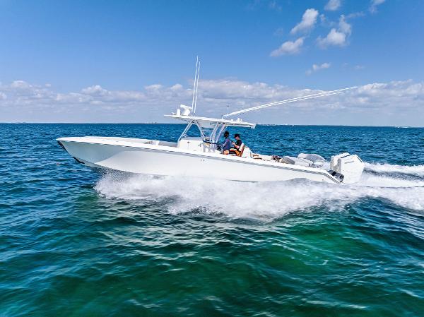 Bahama 41 2015 Bahama Center Console boat cruising on open ocean under clear blue sky.
