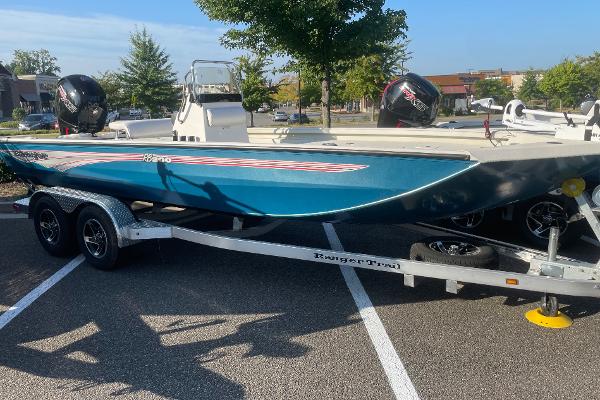 Ranger RB200 2024 Ranger RB200 boat on trailer in parking lot, sunny day.