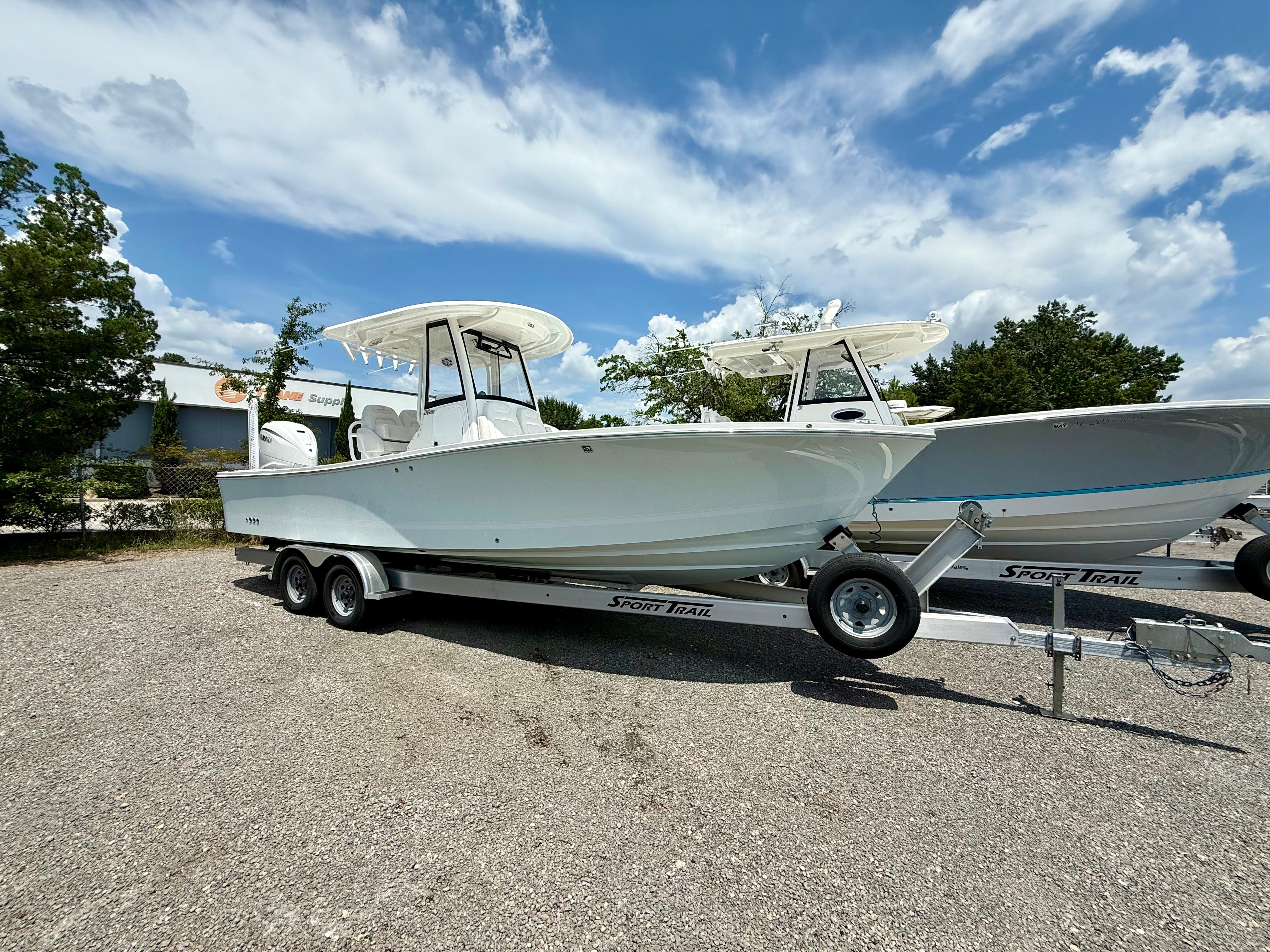 Regulator 26XO 2023 Regulator 26XO boat on trailer under blue sky.