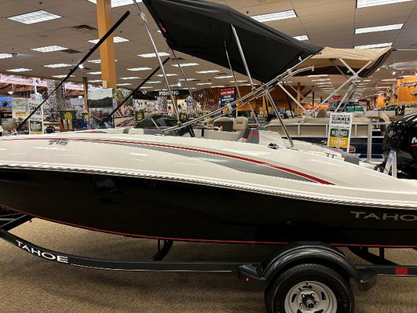 Tahoe T16 2023 Tahoe T16 boat on display in showroom with canopy.