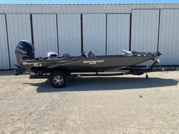 G3 Sportsman 1910 2025 G3 Sportsman 1910 boat on trailer, parked in front of storage units.