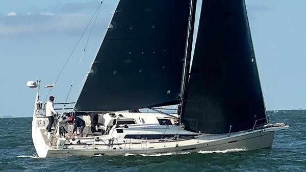 Dehler 42c 2017 Dehler 42c sailboat navigating on open water with black sails.