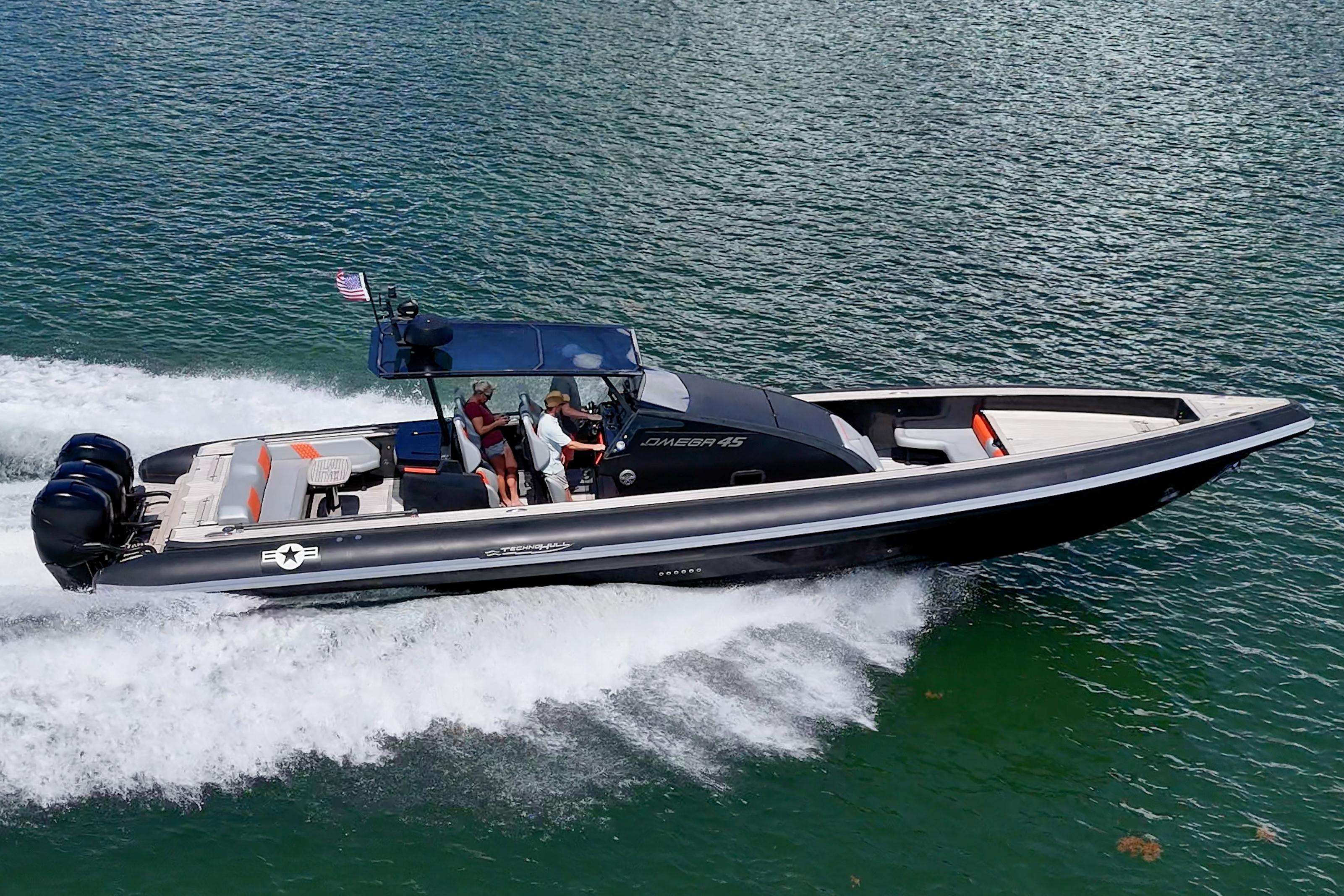 Technohull OMEGA 45 2019 Technohull OMEGA 45 speedboat cruising on water with passengers onboard.