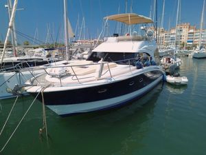 Beneteau Antares 42 2011 Beneteau Antares 42 yacht docked in a marina, surrounded by sailboats.