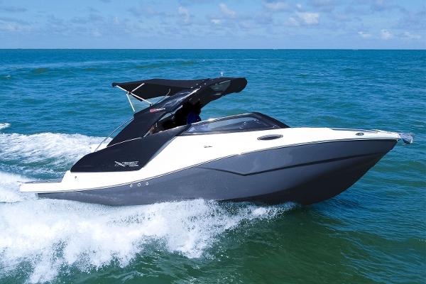 NX Boats 260 Evolution 2025 NX Boats 260 Evolution cruising on open water under clear skies.