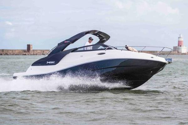 NX Boats 270 Challenger 2025 NX Boats 270 Challenger cruising on open water near a lighthouse.