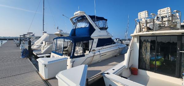 Sea Ray 370 Sedan Bridge Sea Ray 370 Sedan Bridge 1996 docked at a marina on a sunny day.