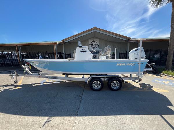 Sea Pro 230 Bay 2024 Sea Pro 230 Bay boat on a trailer in front of a dealership.