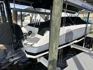 NauticStar 243 DC 2022 NauticStar 243 DC boat on lift, covered and docked.