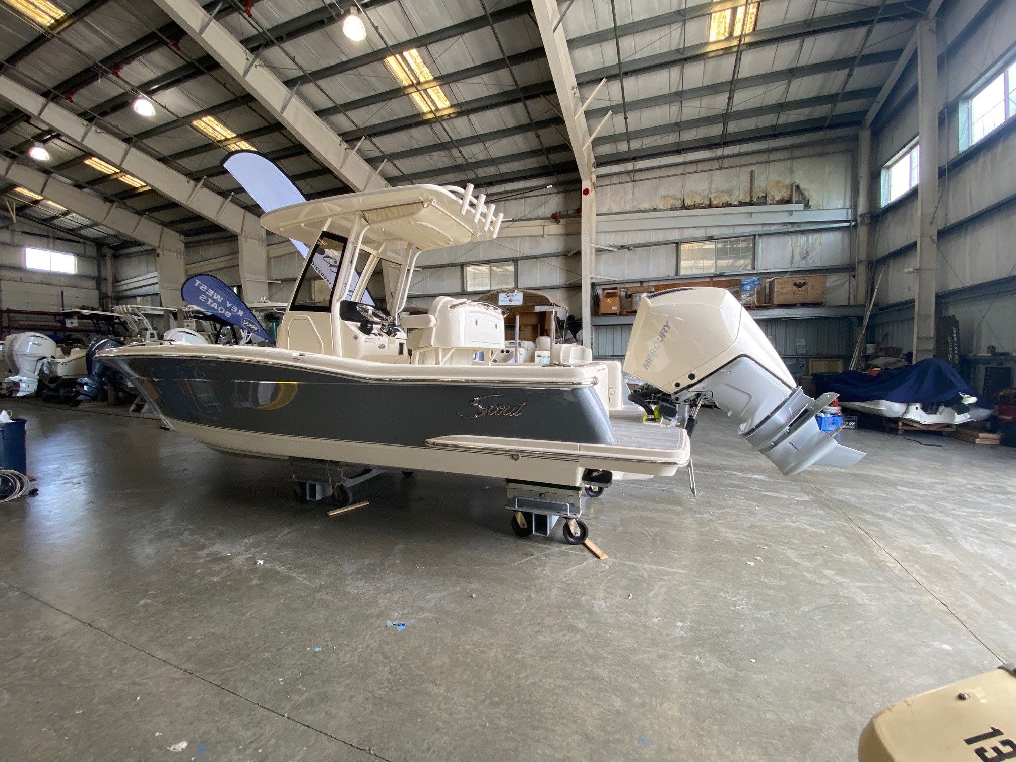 Scout 240 XSF 2026 Scout 240 XSF boat in a spacious indoor storage facility.