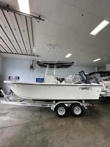 Parker 21 Special Edition 2025 Parker 21SE Center Console boat on trailer in indoor showroom.