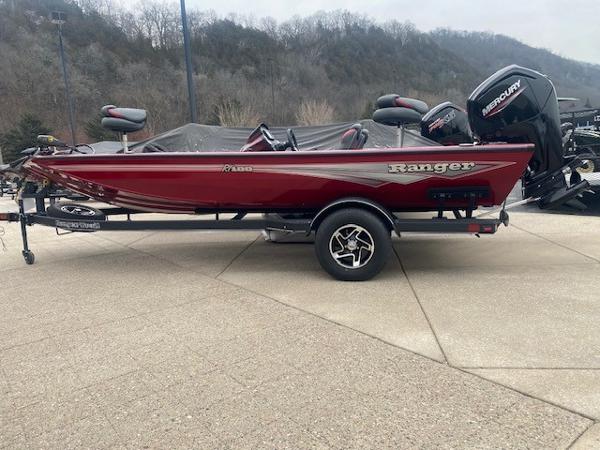 Ranger RT188 2024 Ranger RT188 red fishing boat on trailer, parked outdoors.