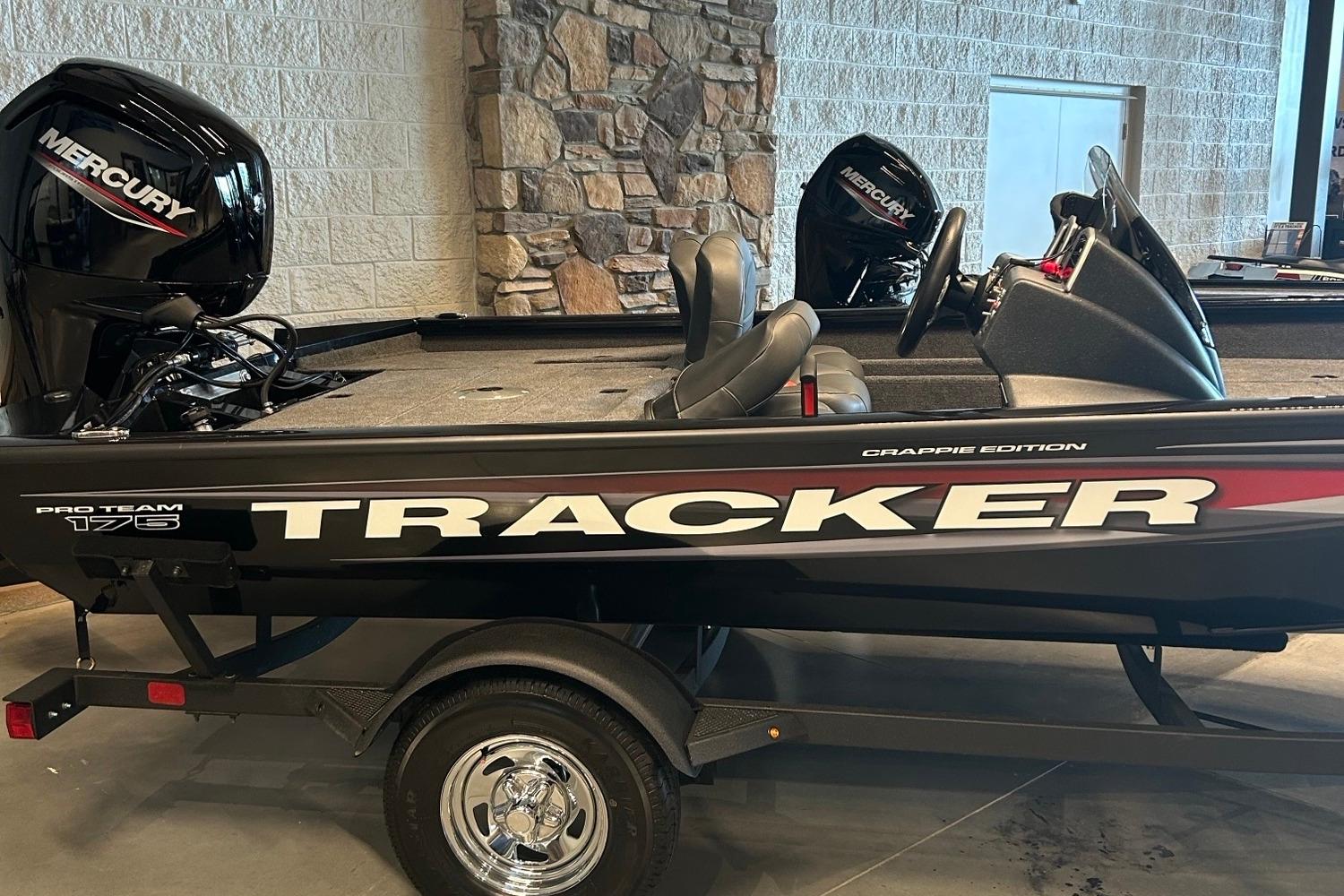 Tracker Pro Team 175 Crappie Edition 2026 Tracker Pro Team 175 Crappie Edition boat with Mercury engine in showroom.