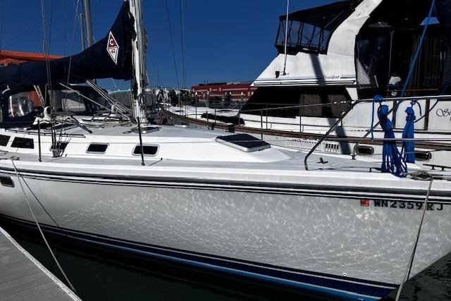 Catalina 42 MkII 1992 Catalina 42' MkII sailboat docked at marina under clear blue sky.