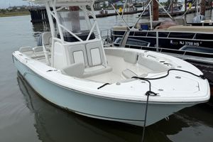 Sea Fox 228 Commander 2022 Sea Fox 228 Commander boat docked in marina, featuring sleek design and spacious seating.