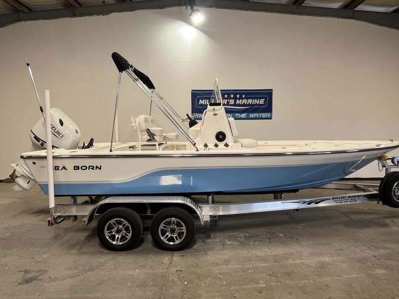 Sea Born FX21 Bay 2025 Sea Born FX21 Bay boat on trailer in showroom.